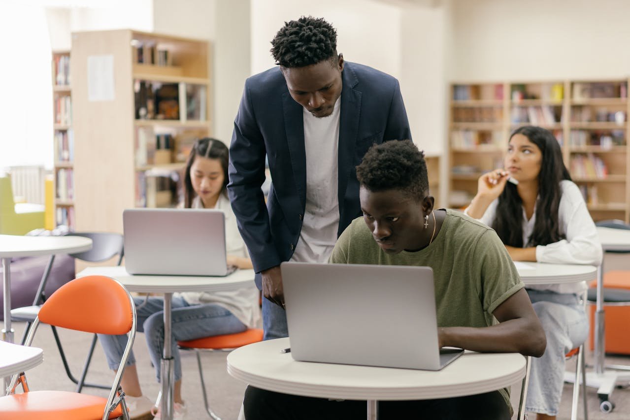 AI tools in UK classroom with teacher using laptop